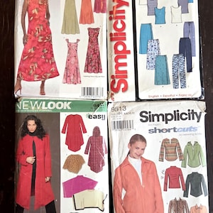 May include: Four vintage sewing pattern packets. The packets feature illustrations of dresses, tops, and pants. The brands are New Look and Simplicity. The packets are white with red and black text.