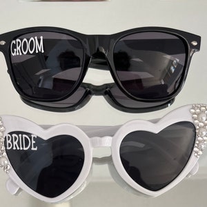 Bride and Groom wedding day honeymoon sunglasses