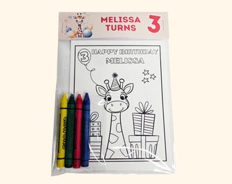 May include: A clear plastic bag containing a coloring page and four crayons. The page features a giraffe wearing a party hat, gifts, and the text HAPPY BIRTHDAY MELISSA. The header card displays a giraffe illustration and MELISSA TURNS 3.