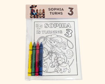 May include: A clear plastic package containing a coloring page and four crayons. The header reads SOPHIA TURNS 3. The coloring page features a cowgirl on a horse with a dog and the text SOPHIA IS TURNING 3. The crayons are yellow, green, red, and blue.