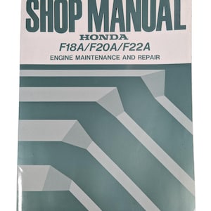May include: A Honda shop manual with the title "SHOP MANUAL" in dark green. It covers engine maintenance and repair for F18A, F20A, and F22A models. The cover has a teal and white geometric design.