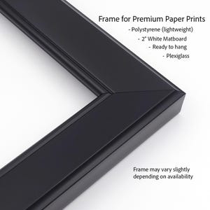 a black frame for premium paper prints, including a polystyrene (lightweight) frame, a 2" white matboard, and a ready-to-hang pllexglass frame. The frame may vary slightly depending on availability.
