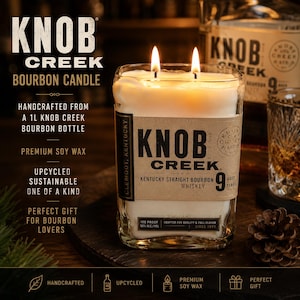 May include: A rectangular glass candle made from an upcycled 1L Knob Creek bourbon bottle, filled with white soy wax and featuring two lit wicks. The label displays the text Knob Creek Kentucky Straight Bourbon Whiskey, aged 9 years.