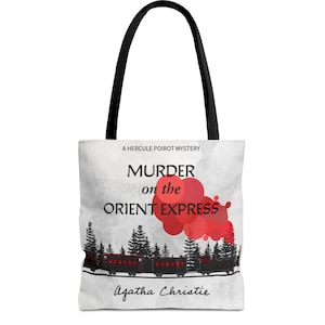 May include: A white tote bag with black handles features a design inspired by Agatha Christie's "Murder on the Orient Express". The design includes the book title, author's name, and a silhouette of a train with red circles in the background.