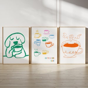 Könnte beinhalten: Drei gerahmte Illustrationen mit Kaffeethema. Die erste zeigt einen grünen Hund, der aus einer Kaffeetasse trinkt. Die zweite zeigt eine Auswahl an Kaffeetassen in verschiedenen Farben. Die dritte zeigt eine Person, die in einer großen Kaffeetasse versunken ist. Der Text "COFFEE LOVER CLUB" befindet sich unter den Kaffeetassen.