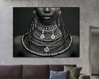 May include: Black and white portrait of a person wearing a large, intricate necklace made of beads and metal. The necklace is layered and features several circular pendants.