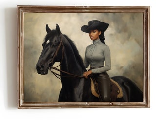 May include: A framed portrait of a person on a black horse. The person wears a black cowboy hat, a gray long-sleeve shirt, and brown leather pants. The horse has a white marking on its forehead. The background is a soft, neutral color.