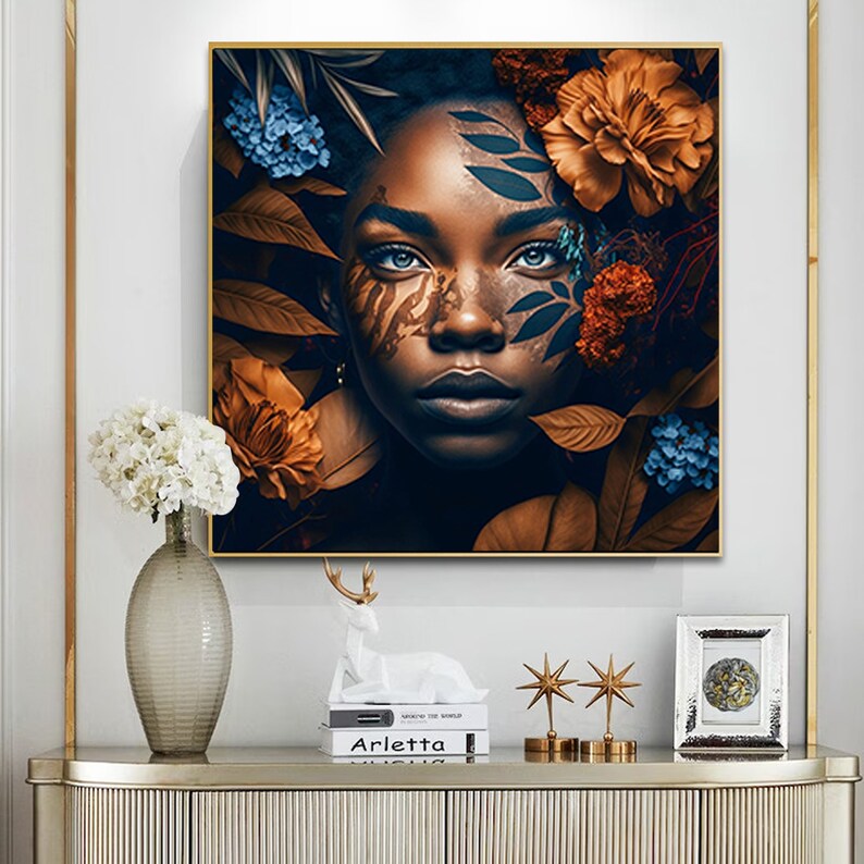 May include: A digital painting of a woman with dark skin and blue eyes. She is surrounded by brown and blue flowers and leaves. The woman's face is painted with brown and black patterns.