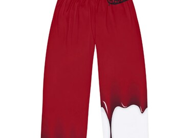 May include: Red pajama pants with a white drip design and the word "Good" in black lettering on the right leg.
