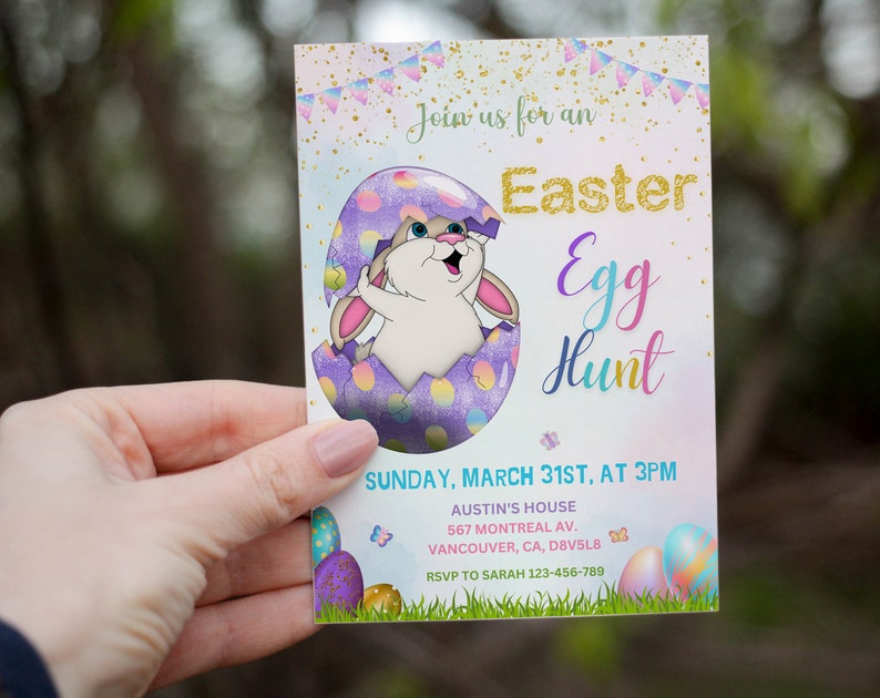 May include: A pastel pink and purple invitation card with a cartoon bunny rabbit peeking out of a cracked egg. The text on the card reads "Join us for an Easter Egg Hunt" and includes the date, time, and location of the event. RSVP information is also included.