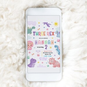 May include: A colorful dinosaur-themed birthday invitation for a child turning two. The invitation features a rainbow-colored text that says "Three Rex" and "Hannah is turning 2". The invitation also includes a variety of colorful dinosaurs and flowers.