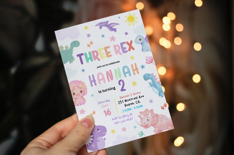 May include: A colorful invitation for a dinosaur themed birthday party for a child named Hannah turning two. The invitation features a rainbow colored text that says "Three Rex" and "Hannah 2" with a variety of dinosaur illustrations. The invitation includes the date, time, and location of the party.