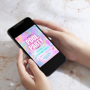 May include: A black smartphone displays a colorful pool party invitation. The invitation features the text "POOL PARTY" and "ELENA'S 12TH BIRTHDAY" in a vibrant design with pastel colors and decorative elements. The phone is held in two hands.