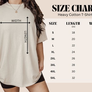 May include: Size chart for a heavy cotton t-shirt. The chart shows the length and width in inches for sizes S through 5XL.