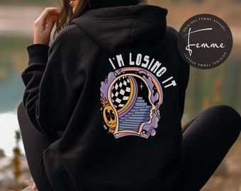 May include: Black hoodie with a graphic of a head with a psychedelic design and the text "I'm Losing It". The graphic is in shades of pink, blue, yellow, and white. The hoodie has a hood and a kangaroo pocket.