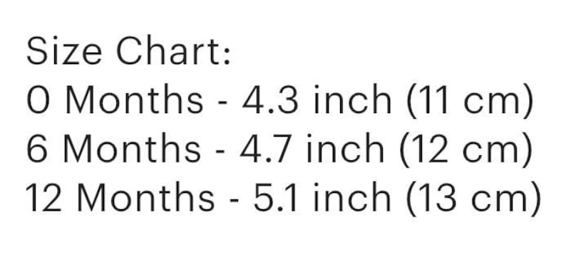 May include: Size chart for baby clothes showing measurements in inches and centimeters. 0 months - 4.3 inches (11 cm), 6 months - 4.7 inches (12 cm), 12 months - 5.1 inches (13 cm).