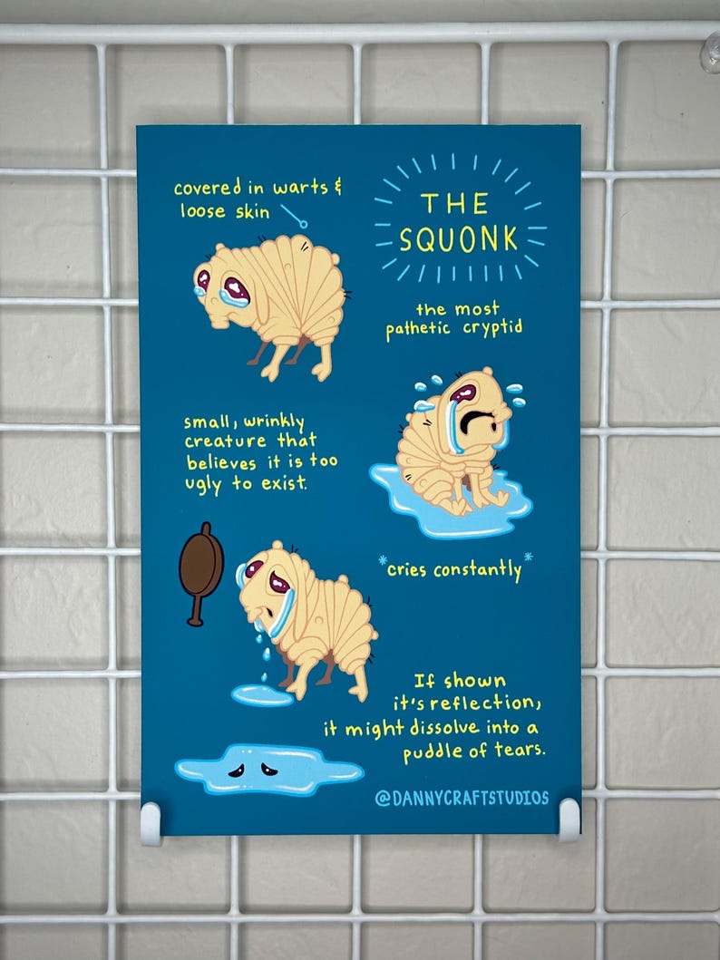 May include: A teal print featuring illustrations of a crying creature labeled "The Squonk." The text describes the creature's features, including warts, loose skin, and a belief in its own ugliness. The print includes the text "cries constantly."