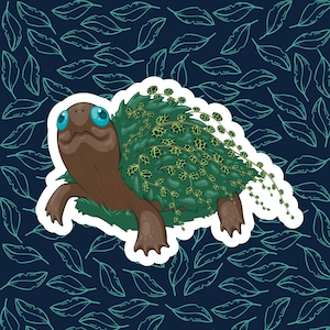 May include: A cartoon turtle with blue eyes is covered in green vines and leaves. The turtle is on a white background with a blue pattern of leaves.