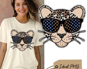 May include: A white t-shirt with a leopard print animal wearing sunglasses. The animal has a black nose and whiskers. The text "Ideal PNG" is on a brown tag.