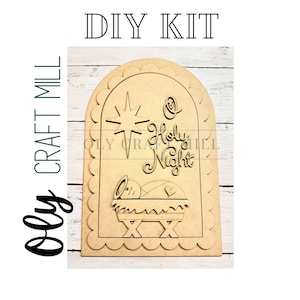 May include: A DIY kit featuring a wooden cutout of a nativity scene with the words "Holy Night" and a star. The design includes a baby in a manger. The text "DIY KIT" is at the top.