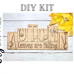 May include: DIY craft kit for a wooden sign that reads "Autumn Leaves are Falling". The sign is made of individual pieces of wood with the letters and leaves cut out. The kit includes fall-colored leaves.