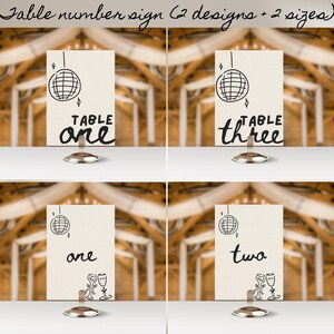 May include: Two designs of table number signs with a disco ball and the words "TABLE one" and "TABLE three" in black script. The other two signs have a disco ball and the words "one" and "two" in black script.