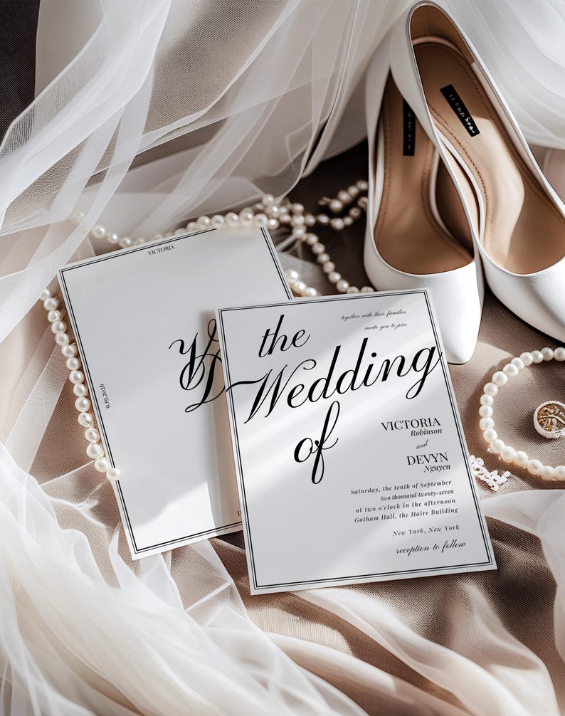 May include: Elegant wedding invitation with the words "the Wedding of" in elegant script. The invitation is white with a black border, and the text includes the names Victoria Robinson and Devyn Nguyen. White high heels and a pearl necklace are also in the image.