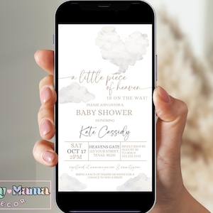 May include: A white and gold baby shower invitation with a watercolor design of clouds. The text reads "a little piece of heaven is on the way!" and includes the details for the baby shower, including the date, time, location, and RSVP information.