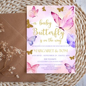 May include: A baby shower invitation with a pink and purple watercolor butterfly design. The text reads "A baby butterfly is on the way" and includes the names "Margaret & Tom".