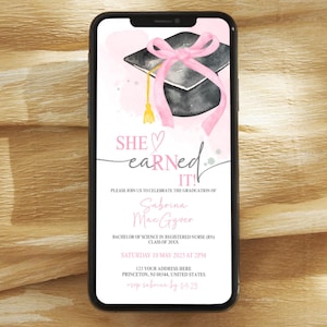 May include: A pink and white graduation announcement with a watercolor illustration of a graduation cap with a pink ribbon. The text reads "SHE earned IT!" and includes the graduate's name, degree, date, time, and location.