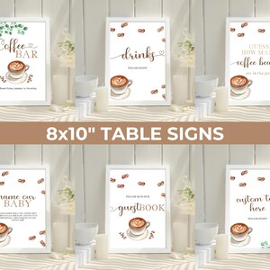 May include: Set of ten 8x10 inch white table signs with brown coffee bean accents and watercolor illustrations of coffee cups. The signs feature text such as "Coffee Bar", "Drinks", "Guess How Many Coffee Beans", "Name Our Baby", "Guestbook", and "Custom Text Here".