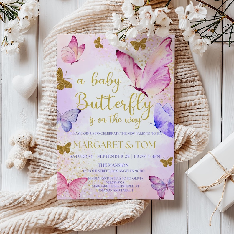 May include: A baby shower invitation with a pink and purple watercolor butterfly design. The text reads "a baby butterfly is on the way" and includes the names "Margaret & Tom" and the date "Saturday, September 29".