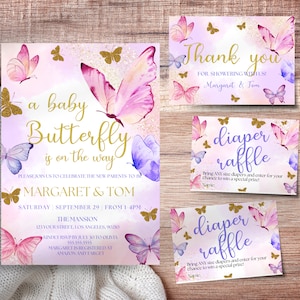 May include: A baby shower invitation with a pink and purple butterfly theme. The invitation features a watercolor butterfly design with gold glitter accents. The text reads "a baby butterfly is on the way" and includes the names "Margaret & Tom".