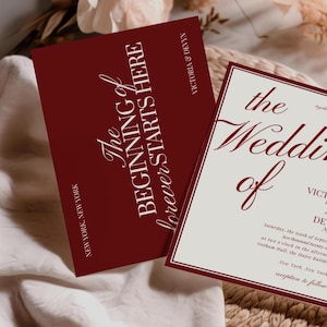 May include: Two wedding invitation cards. One card is burgundy with the text "The Beginning of Forever Starts Here" in white script. The other card is off-white with burgundy text that reads "The Wedding of Victoria and Devyn".