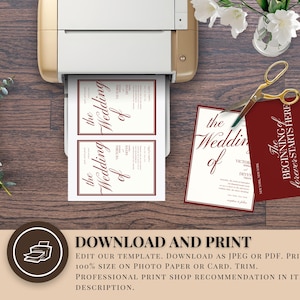 May include: A printer printing wedding invitations with burgundy text. The text reads "the Wedding of". A pair of gold scissors and a burgundy card with text are on the wooden surface. Eucalyptus and white flowers are also present.