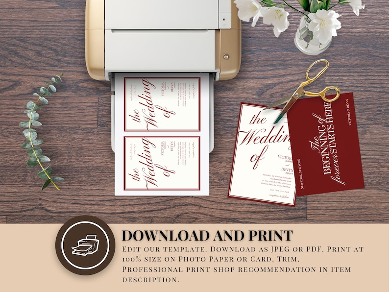 May include: A printer printing wedding invitations with burgundy text. The text reads "the Wedding of". A pair of gold scissors and a burgundy card with text are on the wooden surface. Eucalyptus and white flowers are also present.