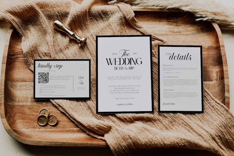 May include: Wedding invitation suite with three cards, featuring black text on a white background. The main card reads "The Wedding" with the names Beth & Rip. A gold wax seal and a gold-colored stamp are also present.