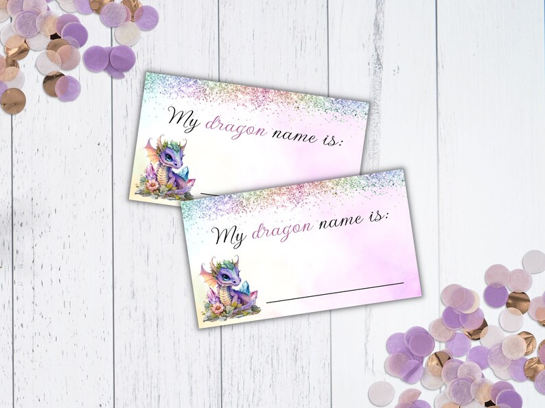 May include: Two printable cards featuring a purple dragon illustration and the text "My dragon name is:" on each card. The cards have a pink and purple watercolour background with glitter.