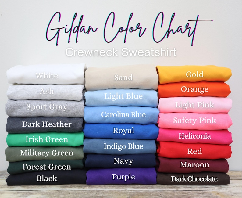May include: A color chart for Gildan crewneck sweatshirts, showcasing a variety of colors. The chart displays folded sweatshirts in shades like white, ash, sport gray, dark heather, and black, alongside others like gold, orange, and red. The text "Gildan Color Chart" is at the top.