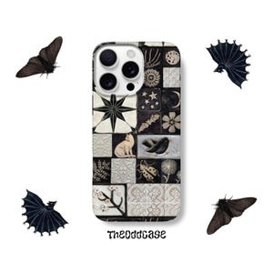 May include: A phone case with a mosaic tile design featuring a cat, stars, bats, and floral elements in black, white, and grey. The case is surrounded by illustrations of bats. The text "TheOddcase" is at the bottom.