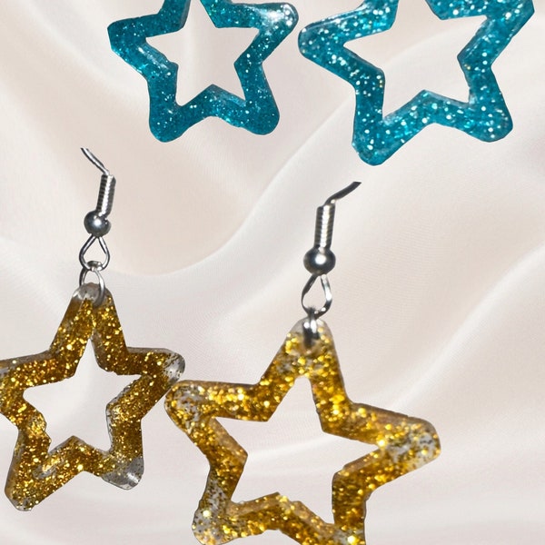 Sparkly blue star resin dangle earrings