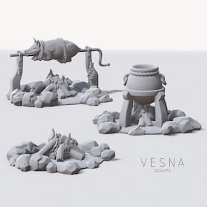 May include: A gray miniature diorama set featuring a roasted pig on a spit, a cooking pot, and a campfire. The pig is tied with rope and positioned over a pile of rocks and logs. The pot sits on a tripod over a small fire. The set is labeled "VESNA SCULPTS."