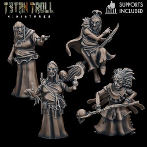 May include: Four detailed 3D printed miniature figures of witches, each with unique poses and accessories. The witches are dressed in flowing robes and have various facial expressions. The figures are painted in a muted brown color.