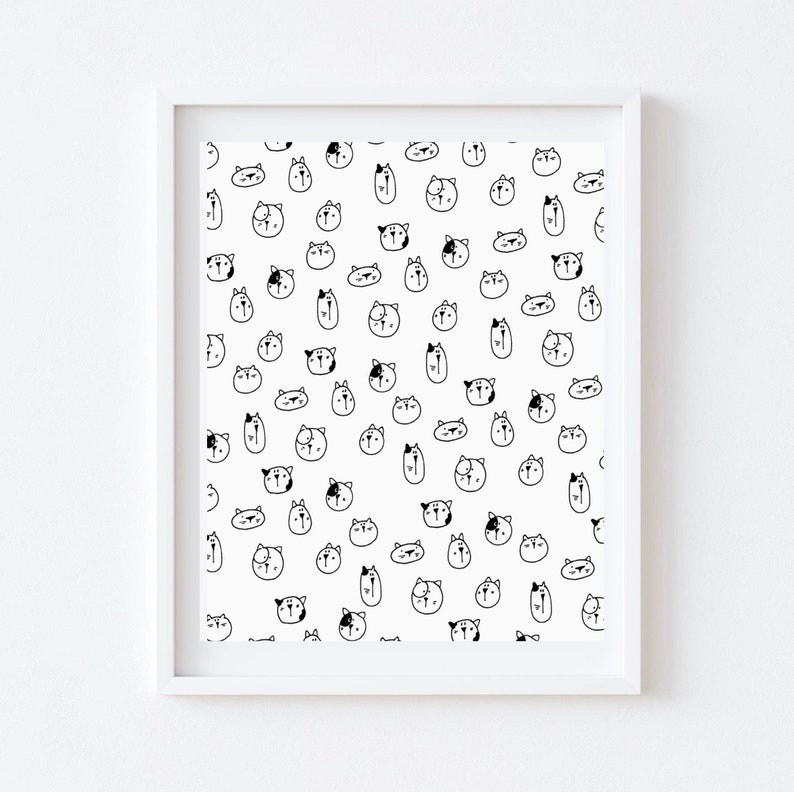 May include: Black and white illustration of a repeating pattern of cat faces. The cat faces are drawn in a simple, cartoon style.