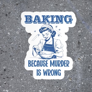 May include: White sticker with blue text that reads "Baking because murder is wrong". A retro-style illustration of a woman in a blue apron is mixing batter in a bowl.