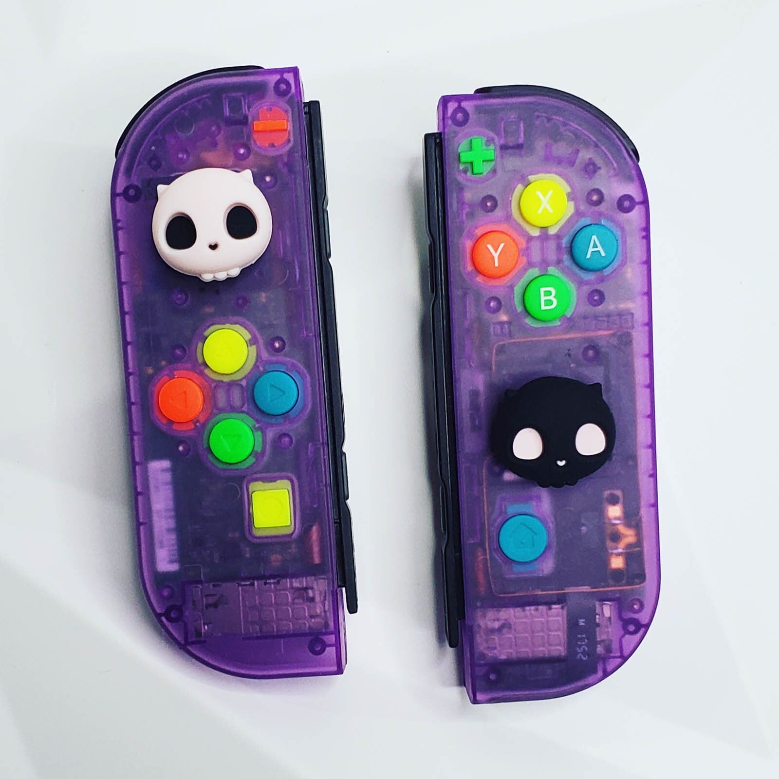 Clear Atomic Purple Nintendo Switch Joy cons With Spewpy Skull