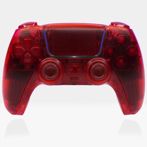May include: A transparent red PlayStation 5 DualSense wireless controller. The controller has a translucent red finish, revealing the internal components.