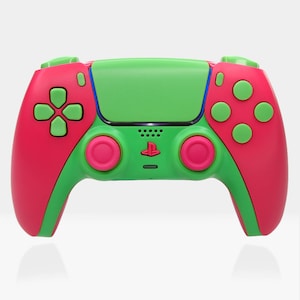 May include: A pink and green PlayStation 5 DualSense controller with pink buttons and a green faceplate.