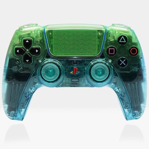 May include: A transparent green and blue games controller with black buttons and a PlayStation logo. The controller has a clear, see-through design. The buttons are coloured black, red, blue, and green. The design is modern and sleek.