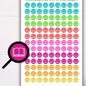 May include: A sheet of colorful book-shaped stickers with white outlines. The stickers are arranged in rows of 7, with each row featuring a different color. The colors are turquoise, green, orange, pink, magenta, yellow, and light yellow.